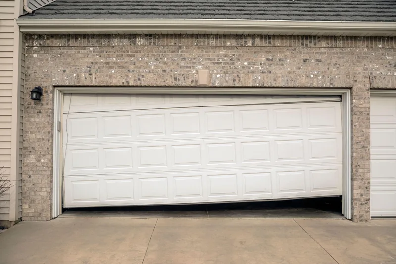 Off-track garage door repair service by American Garage Door Solutions in Daly City, CA