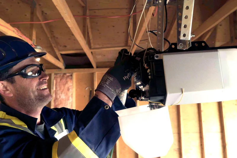 Garage door opener maintenance service in San Mateo ג€” American Garage Door Solutions technician servicing belt-drive opener
