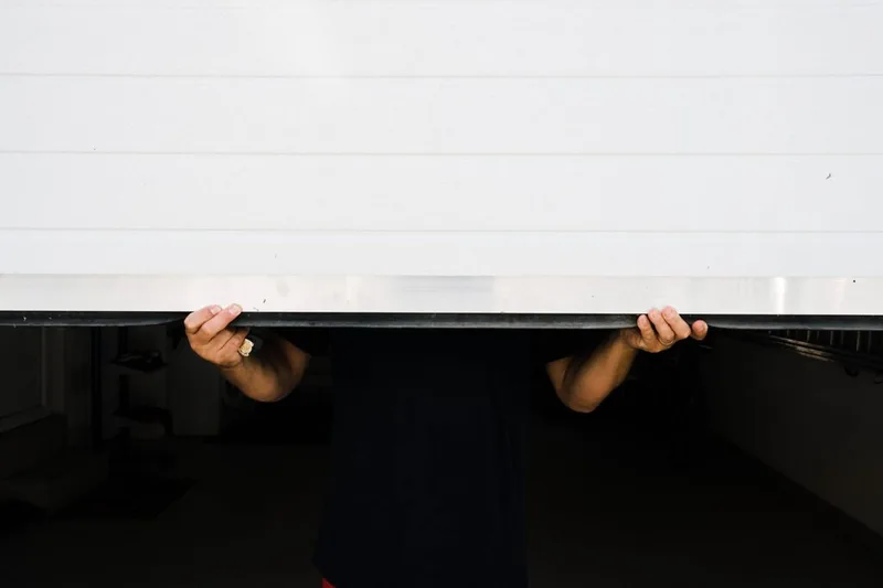 Garage door weather seal replacement by American Garage Door Solutions in San Mateo — new bottom seal installation